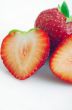 Healthy red strawberry fruit sliced isolated on the white backgr