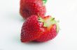 Healthy red strawberry fruit sliced isolated on the white backgr