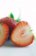 Healthy red strawberry fruit sliced isolated on the white backgr