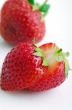 Healthy red strawberry fruit sliced isolated on the white backgr