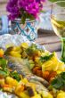 Baked sea bass with vegetables and curcuma