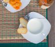 A cup of milk with tangerine marmalde