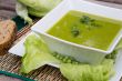 Green peas cream soup with salad leaves