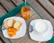 Homemade tangerine marmalade on the small square dessert plate