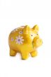 Goldy piggybank in flowers isolated