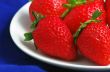 Healthy red strawberry fruit  isolated on the blue background 