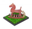 Rocking Horse in a Grass Field