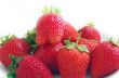 Three fresh strawberries isolated on white background. 