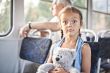 Funny open eyed girl in a tram