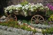 Bed with flowers issued old rural style