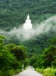The road to white Buddha Image on the mountain