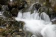 Small mountain waterfall among the rocks. 