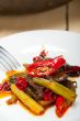 fried chili pepper and vegetable on a wok pan