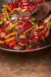 fried chili pepper and vegetable on a wok pan