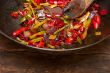fried chili pepper and vegetable on a wok pan