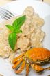 Italian gnocchi with seafood sauce with crab and basil