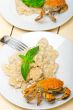 Italian gnocchi with seafood sauce with crab and basil