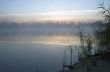 Foggy morning landscape in the autumn park near the lake. Vintag