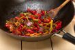 fried chili pepper and vegetable on a wok pan