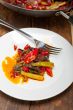 fried chili pepper and vegetable on a wok pan
