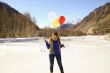 Funny girl with balloons on the hair 