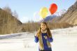 Funny girl with balloons on the hair 