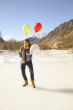 Fun girl with balloons on the hair 