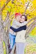 Mother and daughter in autumn