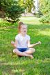 Cute girl in lotus pose