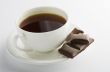Cup of hot tea with dark chocolate