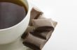 Cup of hot tea with dark chocolate