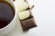 Cup of hot tea with dark chocolate