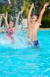 Father and daughter have fun in the pool