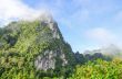 Lush high mountains covered by mist