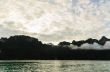 Sunrise over the mountains and green lake