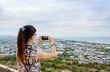 Woman using phone taking pictures