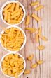 uncooked pasta in three bowls