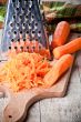 metal grater and carrots