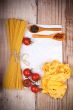 uncooked pasta with tomatoes and spices