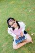 Lovely girl with a laptop on the grass