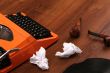 The Orange Vintage Typewriter on the Wood