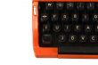 The Orange Vintage Typewriter the White Background