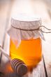 full honey pot and honey stick 