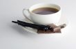 Cup of hot tea with dark chocolate