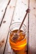 full honey pot and honey stick 