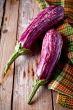 two fresh eggplants