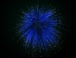 Blue fireworks on background