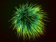 Green fireworks on background