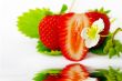 Strawberries and flowers on white background