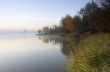 Foggy morning landscape in the autumn park near the lake. Vintag